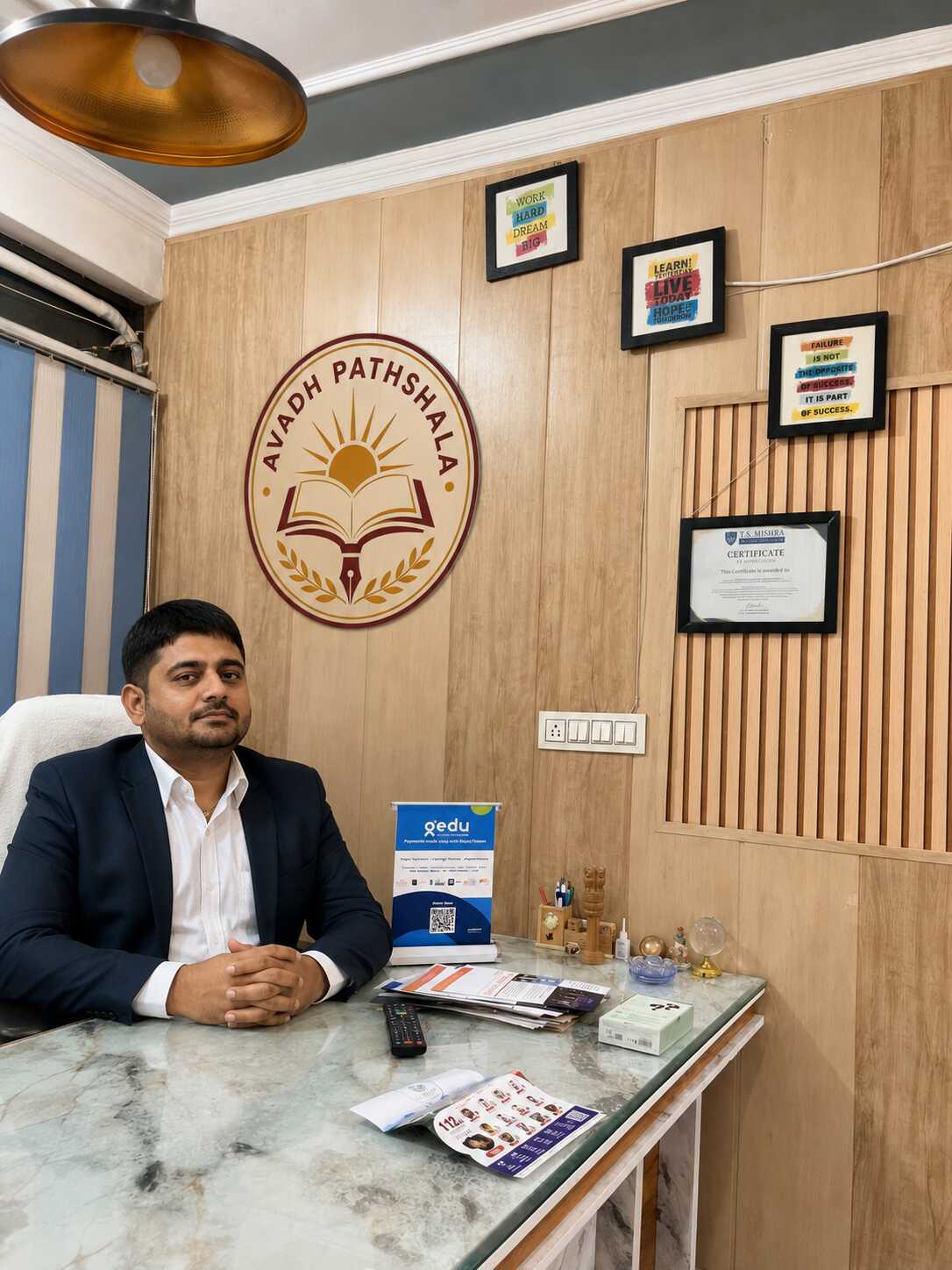 Avadh Pathshala founders advising UP parents and a student at their fixed office desk in Gomti Nagar, Lucknow